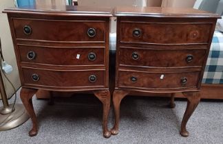 PAIR OF 20TH CENTURY WALNUT 3 DRAWER BEDSIDE CHESTS WITH SHAPED FRONTS ON QUEEN ANNE SUPPORTS.
