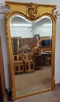 LARGE DECORATIVE FRAMED GILT MIRROR WITH BEVELLED EDGE SURMOUNTED BY CHERUB.