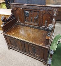 19TH CENTURY OAK SETTLE BENCH WITH DECORATION CARVED CLASSICAL SCENE BACK & LION MARK ARMS