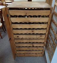 RUSTIC PINE STORAGE UNIT WITH MULTIPLE VEGETABLE TRAY SHELVES.