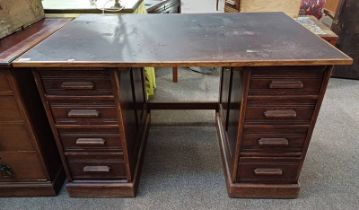 OAK DESK WITH LATER FORMICA TOP & 9 DRAWERS.