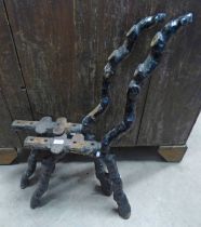 PAIR OF PAINTED CAST IRON BENCH ENDS.