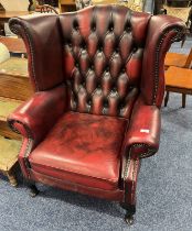 RED LEATHERETTE BUTTONBACK WING BACK ARMCHAIR ON SHORT CABRIOLE SUPPORTS - 105CM TALL