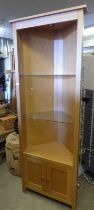 OAK CORNER CABINET WITH GLASS OPEN SHELVES OVER 2 PANEL DOORS