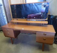 TEAK DRESSING TABLE WITH MIRROR & 4 DRAWERS ON TAPERED SUPPORTS.