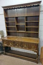 OAK WELSH DRESSER WITH PLATE RACK BACK OVER 3 PANELLED DRAWERS ON TURNED & BLOCK SUPPORTS - 215CM
