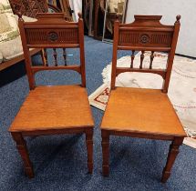 PAIR OF 19TH CENTURY OAK HALL CHAIRS WITH CARVED DECORATION & PANEL SEATS ON SQUARED TAPERED