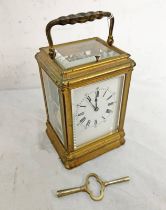 LATE 19TH OR EARLY 20TH CENTURY FRENCH GILT METAL REPEATING CARRIAGE CLOCK WITH WHITE & BLACK FACE,