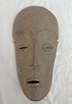 MAKONDE LIPIKO HELMET MASK WITH HAIR AND INCISED DECORATION,