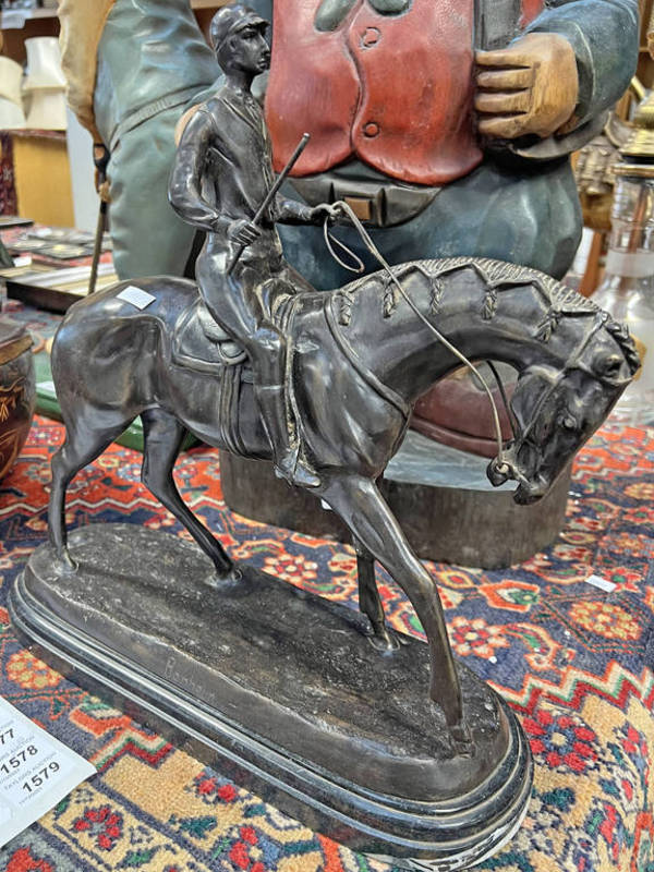 METAL SCULPTURE OF A HORSE AND A JOCKEY SIGNED BONHEUR ON A HARDSTONE BASE,