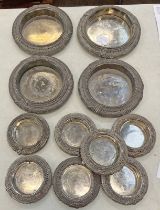 FOUR WHITE METAL MIDDLE EASTERN CIRCULAR TRAYS AT 21.