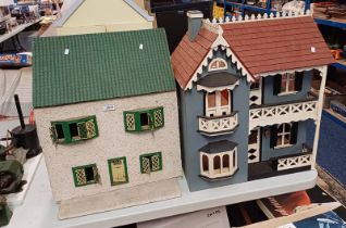 FOUR WOODEN DOLLS HOUSES.