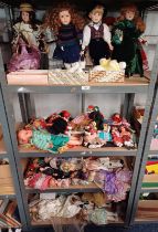 QUANTITY OF VARIOUS DOLLS OVER 4 SHELVES