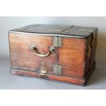 An Early 20th Century Chinese Hardwood and Brass Bound Travel Box, with a hinged lid, enclosing a