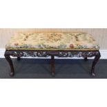 An Early 20th Century Chinese Hardwood Carved Long Stool, with a later upholstered seat, with