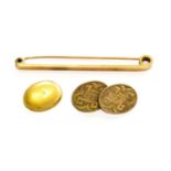 A Single 9 Carat Gold Cufflink; A 9 Carat Gold Bar Brooch, length 5.7cm; and A 15 Carat Gold Oval