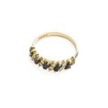 An 18 Carat White Gold Sapphire and Diamond Half Hoop Ring, finger size OGross weight 3.4 grams.