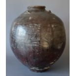 A Large Provincial South East Asian Brown Glazed Stoneware Vessel, 42cm highNo cracks or