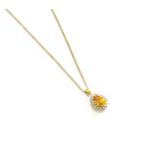 A Yellow Sapphire and Diamond Cluster Pendant on Chain, the pear shaped yellow sapphire within a