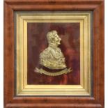 A Brass Relief Work Portrait, Duke of Wellington, on red velvet ground, 40cm by 35cmFrame chipped