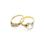 A 9 Carat Gold Paste Three Stone Ring, finger size P1/2; and A Solitaire Ring, stamped '18CT',