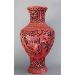 A Chinese Cinnabar Lacquer Vase, of baluster form, decorated with figures in landscape panels within