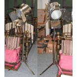 A Pair of Reproduction Chrome Film Spotlights, on tripod bases, 187cm