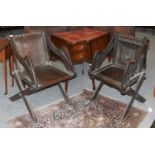 A 19th Century Carved Oak Glastonbury Chair, together with another similar (2)