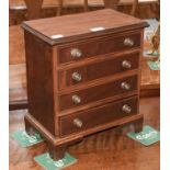 A Mahogany Miniature Four-Height Straight Front Chest of Drawers, on bracket feet, 32cm by 19cm by