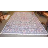 A Saroukh Design Carpet, the ivory field of vines centred by a medallion, framed by palmette and