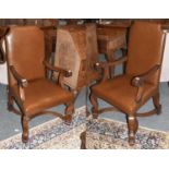 A Pair of Oak and Leather Open Armchairs, in 17th century style, the scroll carved legs joined by