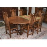 A 20th Century Oak Dining Table, the three plank oval top of pegged construction, raised on a