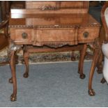 A Charles Walker & Son's Ltd, Harrogate Reproduction Carved Walnut Side Table, the shaped top with