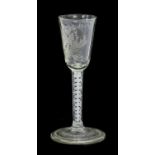 A Wine Glass, circa 1750, the rounded funnel bowl engraved with a rose, the reverse inscribed