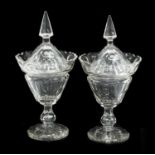 A Pair of Cut Glass Sweetmeat Vases and Covers, 19th century, of urn form with spire knops and