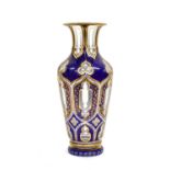 A Bohemian Blue Overlay Clear Glass Vase, circa 1870, of baluster form cut with gothic arch panels