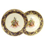 A Pair of Derby Porcelain Armorial Plates, circa 1820, painted with arms and motto within a blue