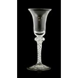 A Wine Glass, circa 1750, the bell-shaped bowl on a knopped opaque twist stem and circular