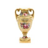 A Coalport Vase, circa 1810, of twin-handled urn form, painted with a panel of flowers on a Church