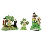 A Pearlware Figure Group, circa 1820, as a boy and girl playing musical instruments on a mound