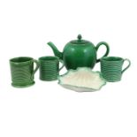 A Green-Glazed Earthenware Teapot and Cover, circa 1770, of ovoid form and with fluted spout20cm