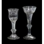 A Wine Glass, circa 1730, the pan-topped bowl on a ball knop with air tears and plain stem with