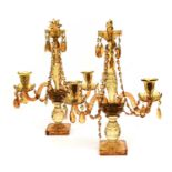 A Pair of Amber Glass Table Lustres, in Georgian style, the central columns flanked by scroll