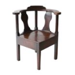 A George III Joined Oak Corner Armchair, 3rd quarter 18th century, with outswept arms and moulded