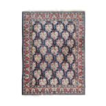 Saroukh CarpetWest Iran, circa 1970The Indigo field with an allover floral lattice design enclosed