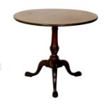 A George III Mahogany Tripod Table, late 18th century, the circular one piece top pivotting on a
