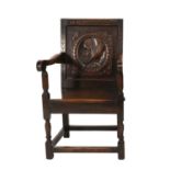 A Carved Oak Armchair, late 19th/early 20th century, in 17th century style, the guilloche carved top