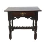An Early 18th Century Joined Oak Side Table, the boarded top of peg construction above a single