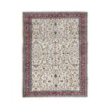Anatolian Carpet, circa 1950The cream field with an allover design of scrolling vines enclosed by