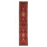 Narrow Saroukh RunnerWest Iran, circa 1970The raspberry field with a column of diamond medallios